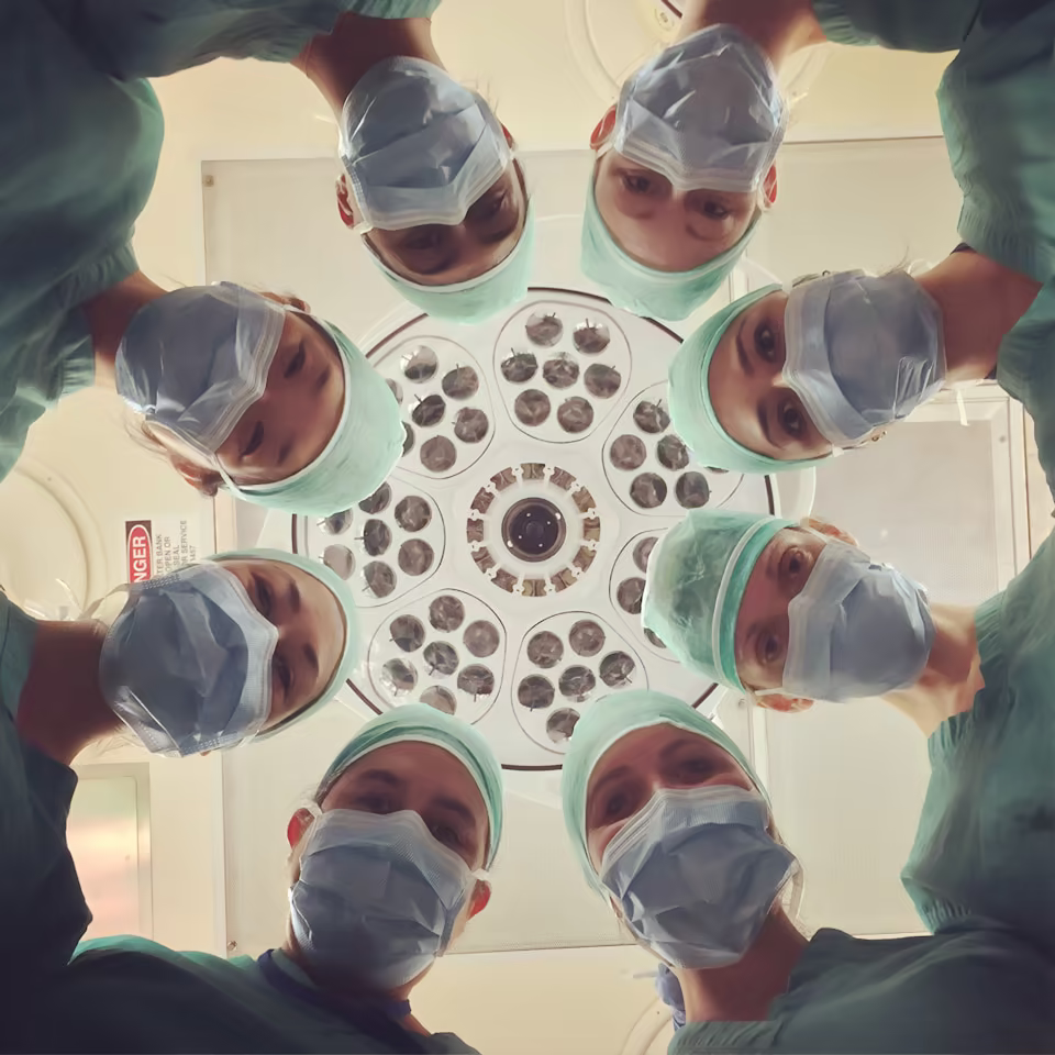 Clinical team coordinating care in a bright community healthcare setting.
